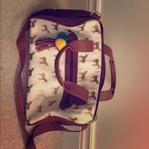A white and brown unicorn print bag